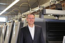 Dr. Michael Fries on the podium of the „Online Print Symposium 2015“ in Munich